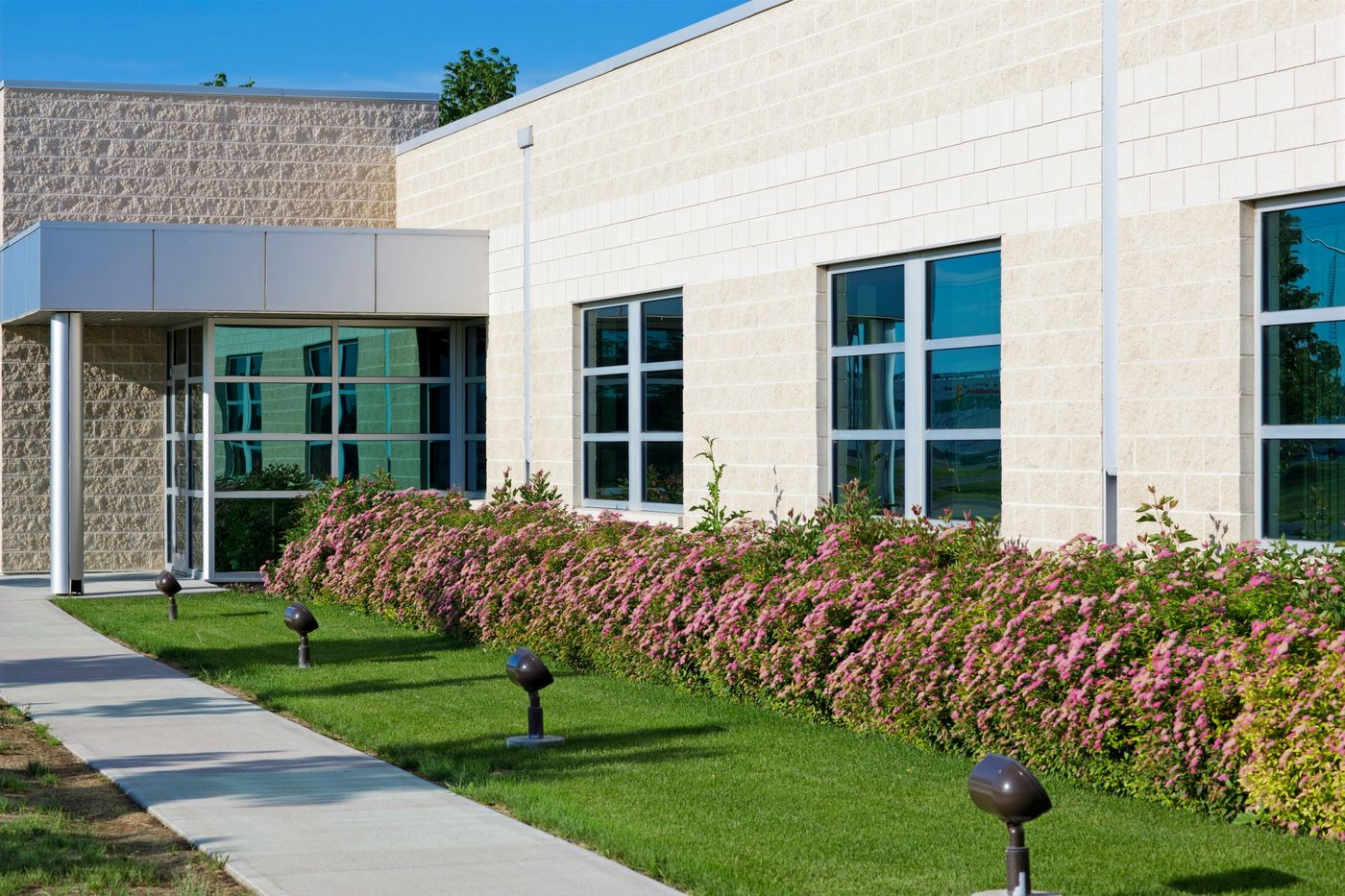 Commercial building with flowering landscape beds in Palm Springs